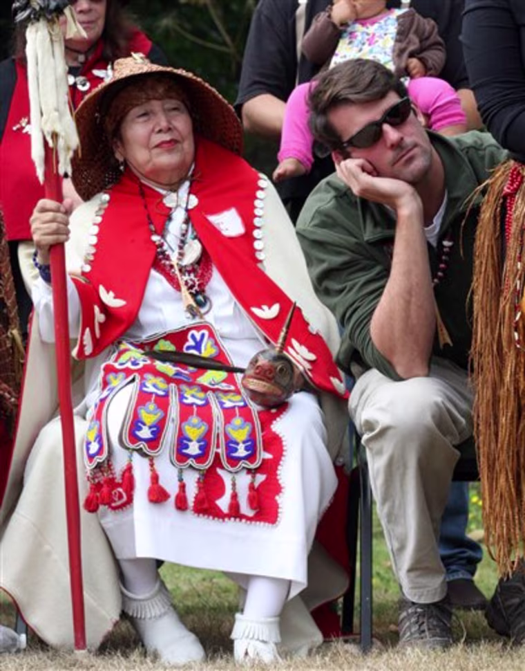 William Clark's 8th generation descendants Rick Holton, right, and Anna Haala, 77, ;eft,  of Seattle, look on during the canoe reparation ceremony, Saturday Sept. 24, 2011, at Fort Columbia, near Chinook, Wash. Back in 1806, explorers Meriwether Lewis and William Clark stole a canoe from native Americans living on the Pacific Coast. More than 200 years later, Clark's descendants are making amends to the Indian's descendants  by having a 36-foot replica built for them. (AP Photo/Rick Bowmer)